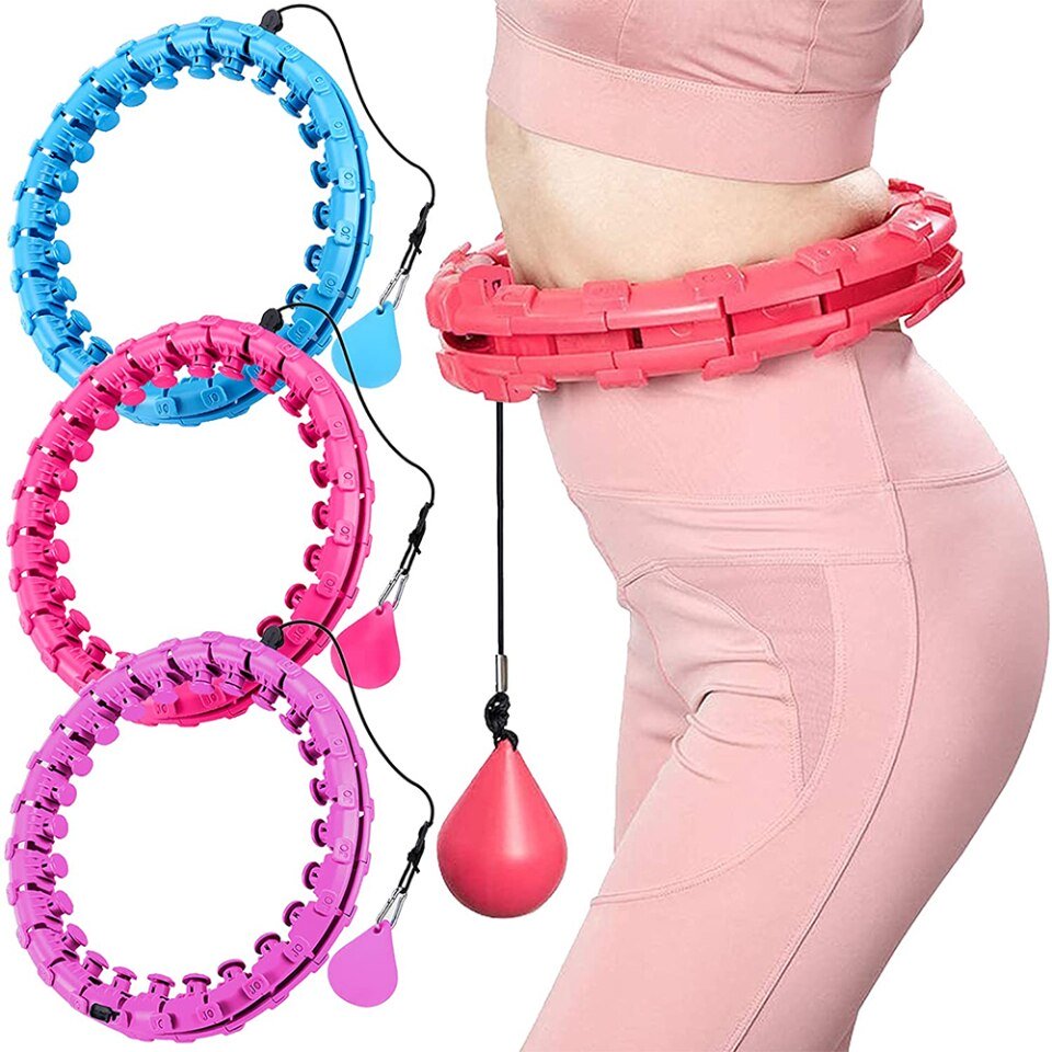 Woman using an adjustable smart weighted fitness hoop with a pink 28-knot design Woman using an adjustable smart weighted fitness hoop with a pink 28-knot design